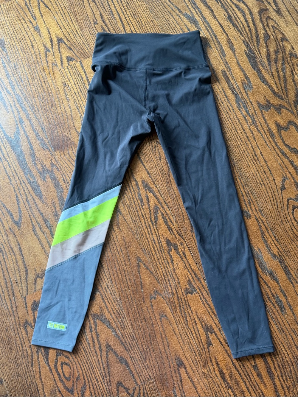 P.E Nation Black Leggings with Neon Green and Gray Stripe Accent